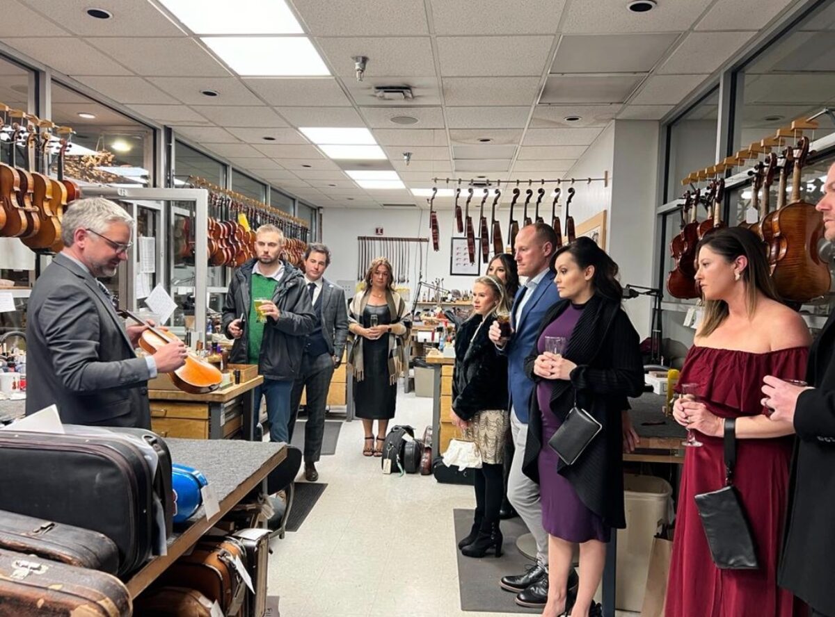 YPO New Mexico members at a hands-on violin workshop with a master luthier